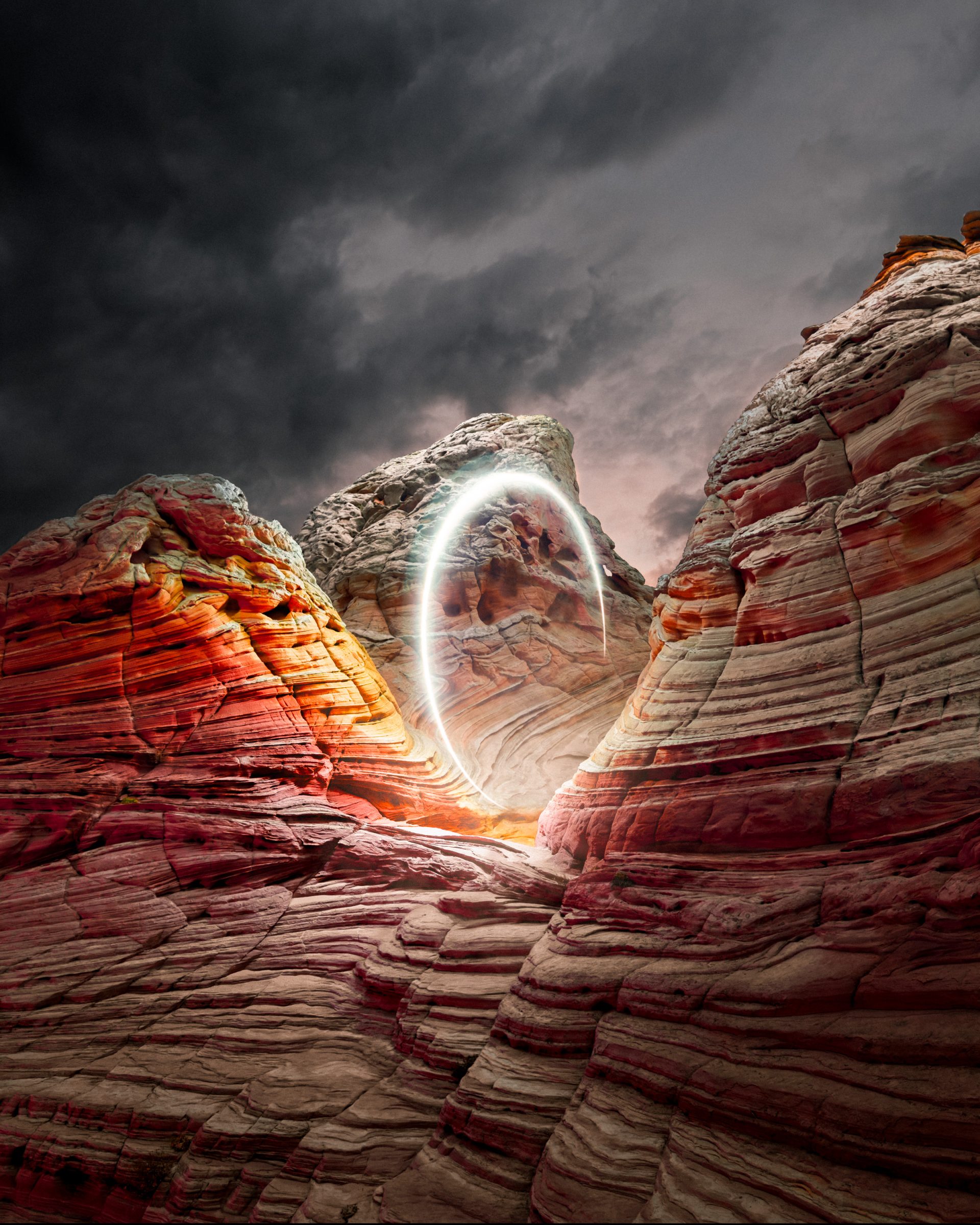 Futuristic rocky canyon landscape with a glowing, circular portal and dramatic, cloudy sky overhead—perfect for nighttime landscape photography.