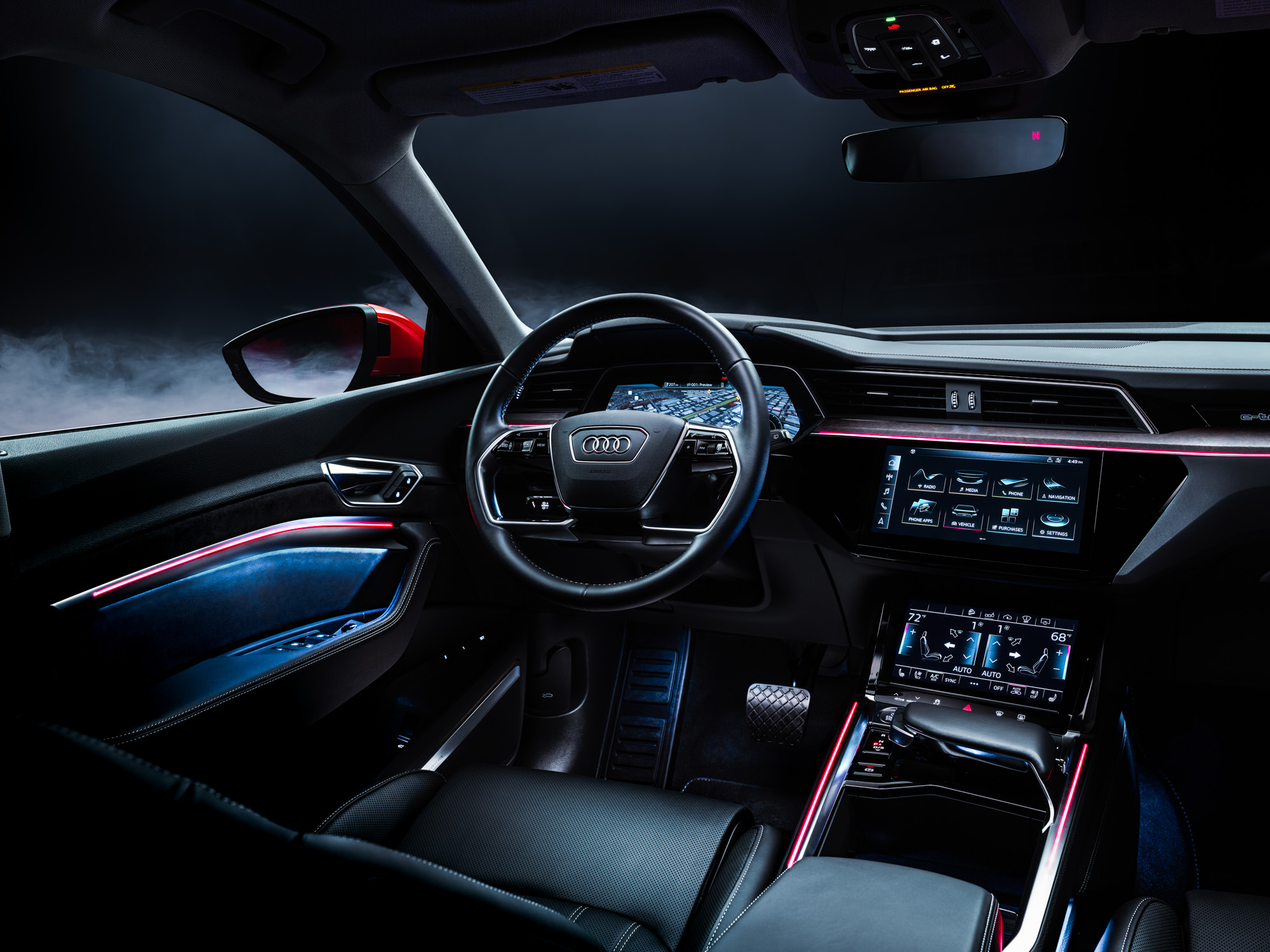 Futuristic Audi car interior with digital displays, ambient lighting, and a sleek black dashboard at night—captured perfectly as if seen through the eyes of a photographer.
