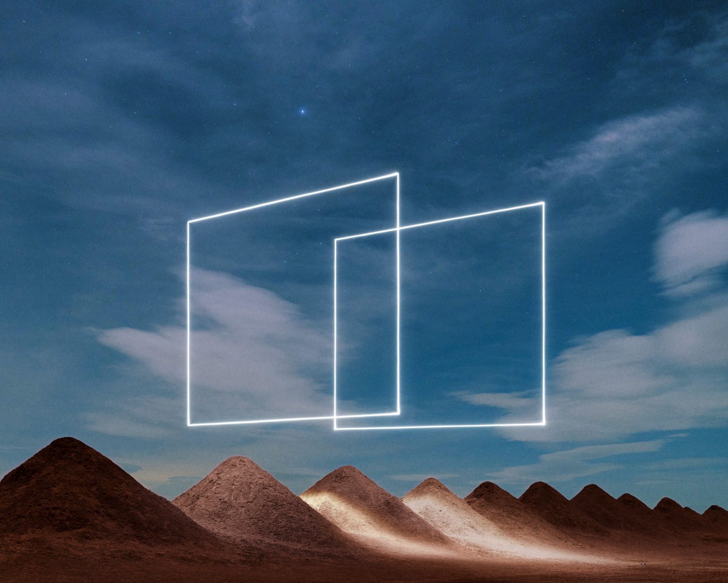 Two glowing white squares float above a row of sand mounds under a starry night sky, creating an enchanting scene of drone light art perfect for nighttime landscape photography.